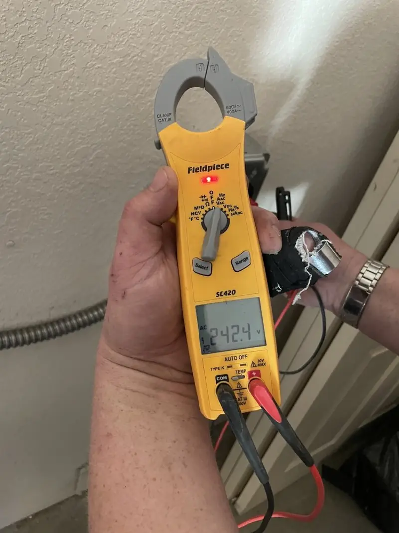 Voltage testing with clamp meter during Electrical Installation Services in Garrison